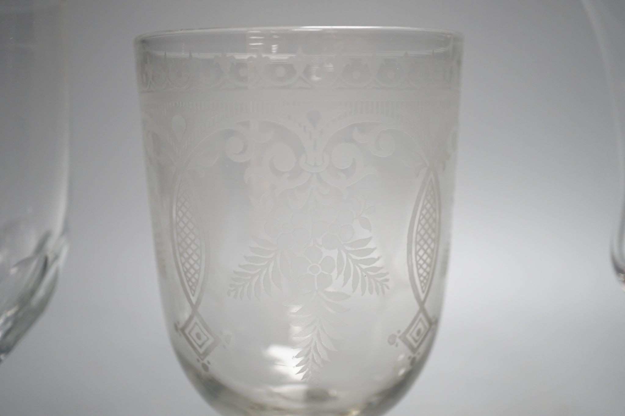 A mid 18th century trumpet bowled wine glass and three other glasses, 18cm